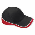The Beechfield BC171 is a baseball cap featuring a black top, red sides, and an underside of the brim with white piping along the edge.