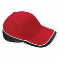 Product data description: The Beechfield BC171 is a red baseball cap featuring a brim trimmed with black and white and black accents on the rear section.