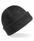 A black fleece beanie with a turned-up brim. The Beechfield BC243 appears soft and warm, suitable for cold weather. The design is simple and functional, without any visible logos or decorations.