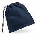 The BC285 Beanie by Beechfield in navy blue features a drawstring closure and is displayed at an angle, emphasizing its soft texture and minimalist design.