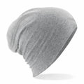 The BC368 by Beechfield is a soft, gray slouchy beanie hat crafted from lightweight fabric, displayed in a side view. It exudes a relaxed and comfortable vibe with its subtle texture, making it an ideal choice for casual wear.