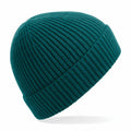 The BC380 by Beechfield is a teal knit beanie hat with a ribbed texture, showcased on a white background. It looks soft and cozy, making it perfect for cold weather.
