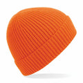 The Beechfield BC380 beanie hat is displayed against a plain white background, highlighting its simple, cozy design and snug fit. Its vibrant orange color and ribbed knit texture are showcased effectively.