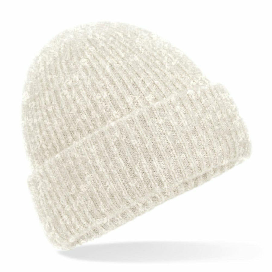 The BC386 by Beechfield is a cream-colored, knitted beanie featuring a ribbed texture and a folded brim, displayed against a white background.