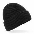 A Beechfield BC386, which is a black ribbed knit beanie featuring a folded cuff, displayed on a white background.