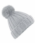 A light gray knit beanie with a ribbed texture and a large, fluffy pom-pom on top. The Beechfield BC413 beanie features a folded cuff for added warmth and style.