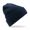 The Beechfield BC425 is displayed against a white background, showcasing a navy blue knit design with a folded brim. The beanie looks soft and warm, making it ideal for cold weather.