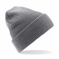 The Beechfield BC425 is a gray knitted beanie featuring a folded brim, set against a white background. The fabric's texture and ribbing are prominently displayed, enhancing its cozy and warm appearance.
