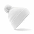 Beechfield's BC426 features a white knit beanie with a pom-pom on top, showcased against a simple white background. The beanie is angled to emphasize its texture and minimalist design.