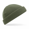 The Beechfield BC43R, a green knit beanie with a folded brim, is displayed against a white background, slightly angled to the left. The texture of the fabric is visible, highlighting its warmth and coziness.