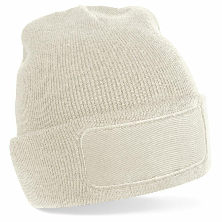 A Beechfield BC445 beige knit beanie featuring a blank rectangular patch on the front.