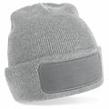 A Beechfield BC445 gray knitted beanie featuring a folded brim and a rectangular patch on the front.