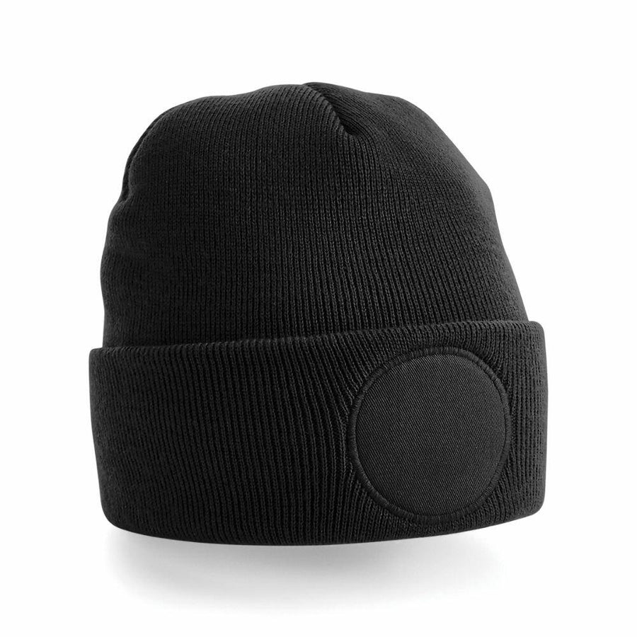 Beechfield BC446 black knit beanie featuring a folded brim and a circular patch on the front.