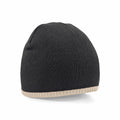 A Beechfield BC44C black knit beanie with a beige trim at the base, viewed from the back.
