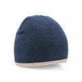 A Beechfield BC44C blue knit beanie featuring a light beige trim at the bottom.