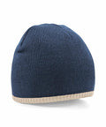 A blue knit Beechfield BC44C with a light beige trim around the edge. The Beechfield BC44C is shown in a three-quarter view, displaying its simple and seamless design.