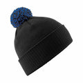 A black beanie hat from Beechfield (BC450) featuring a blue and black pom-pom on top.