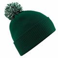 A Beechfield BC450 knit beanie in green, featuring a ribbed cuff and a pom-pom on top.