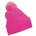 The BC450 by Beechfield is a lively pink knitted beanie featuring a folded brim and a large pom-pom on top.