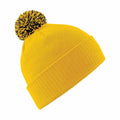 Beechfield's BC450 is a vibrant yellow knit beanie topped with a black and yellow pom-pom and features a ribbed, folded brim.