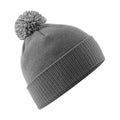 The Beechfield BC450 gray knitted winter beanie, featuring a ribbed fold-over cuff and a pom-pom on top, is displayed against a white background.