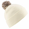 Beechfield's BC450 is a cream-colored knit beanie featuring a folded brim and topped with a brown and white pom-pom.