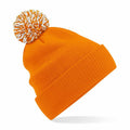 The Beechfield BC450 is an orange knit beanie featuring a white and orange pom-pom on top, displayed against a white background.
