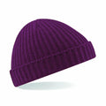A Beechfield BC460 beanie in purple, featuring a ribbed texture and a folded brim, positioned against a white background.