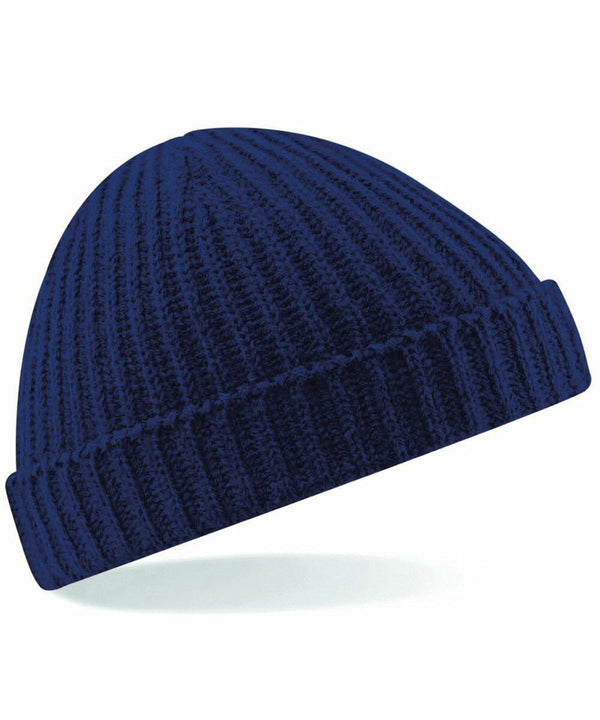 A navy blue knit beanie hat with a ribbed texture and a folded brim, isolated on a white background. The Beechfield BC460 is slightly tilted to the right.