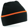 The Beechfield BC471 beanie features a black knit design with an orange stripe running horizontally around it. It has a folded cuff and offers a warm, cozy fit, making it ideal for cold weather.