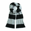 Beechfield's BC479 scarf, featuring black and gray stripes with fringe ends, neatly folded.