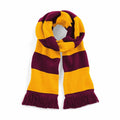 The BC479 scarf from Beechfield features bold horizontal stripes in maroon and yellow, with fringed ends.