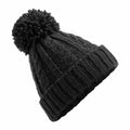 The Beechfield BC480, a black knitted beanie featuring a pom-pom on top, is showcased against a white background.