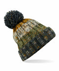 Beechfield BC486 knit winter hat with a black pom-pom, showcasing a multicolored pattern in olive green, mustard yellow, and gray.