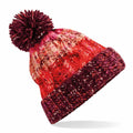 Introducing the Beechfield BC486: a vibrant knitted beanie featuring a striking red, pink, and orange pattern, complete with a large pom-pom on top. This beanie boasts a textured design and a thick, ribbed fold at the bottom edge, all showcased against a crisp white background.