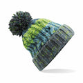 The Beechfield BC486 is a vibrant knitted winter hat adorned with a pom-pom. It showcases a blend of blue, green, and gray stripes interwoven with intricate patterns, and includes a ribbed brim for a snug fit.