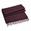The Beechfield BC500, a folded dark purple scarf with fringed ends, is laid neatly on a white surface.