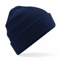 A Beechfield BC52N textured knit beanie in blue, featuring a folded brim, showcased against a white background.