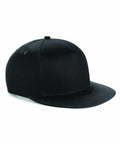 A black BC615 from Beechfield with a flat brim and a classic six-panel design, shown from a side angle on a white background. The hat appears simple and unadorned, with a smooth fabric and no visible logos or embellishments.