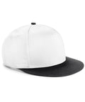 A side view of the Beechfield BC615 cap shows its white body complemented by a black brim. This cap features a flat bill and a button on top, crafted from plain and smooth fabric that makes it ideal for customization.