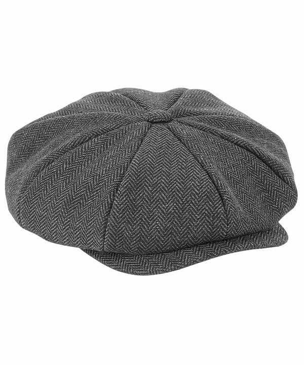 A Beechfield BC628 made from a herringbone-patterned fabric. The cap features a small, stiff brim in the front and a button on top where the panels converge.