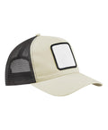 The Caps product is a beige trucker hat featuring a curved brim, black mesh back, and a blank white square patch outlined in black on the front, angled to the right.