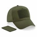A Beechfield BC638 olive green baseball cap featuring a Velcro patch on the front, with an additional Velcro patch placed alongside it against a plain white background.