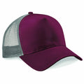 The Beechfield BC640 is a trucker cap featuring a solid maroon front panel with gray mesh at the back. It includes a curved brim and an adjustable snapback closure for a comfortable fit.