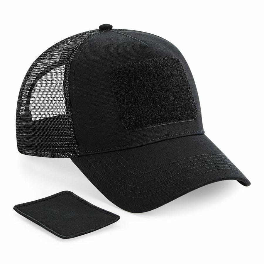 A Beechfield BC641 black trucker cap featuring a mesh back and a square Velcro patch on the front, displayed with an additional Velcro patch.