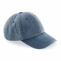A Beechfield BC655 blue denim baseball cap, designed with a curved brim, six panels, and ventilation eyelets.