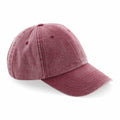 Displayed against a white background is the Beechfield BC655, a baseball cap in faded red, featuring a curved brim and visible stitching details.