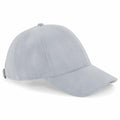Introducing the Beechfield BC656: a sleek baseball cap in light gray, showcasing a curved brim and minimalist design. It features an adjustable strap at the back for a perfect fit. The cap is stylishly displayed at an angle to emphasize its craftsmanship and detailed stitching.