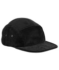 The Caps is a black corduroy five-panel cap featuring a curved brim and two metal eyelets per side for ventilation, displayed on a white background.