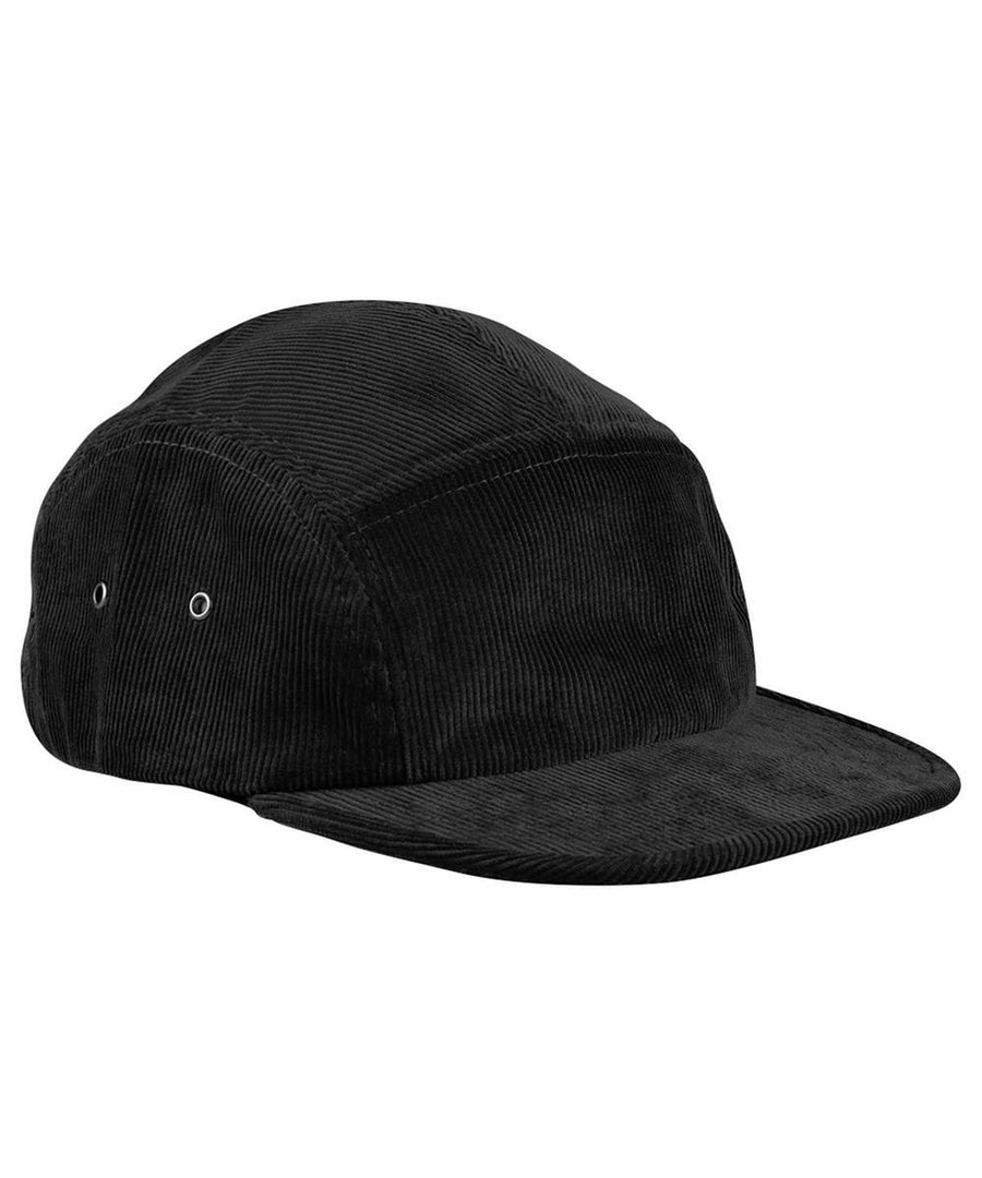 The Caps is a black corduroy five-panel cap featuring a curved brim and two metal eyelets per side for ventilation, displayed on a white background.